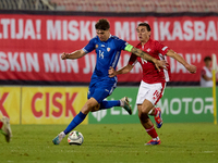 Artur Craciun of Moldova is closely followed by Alexander Satariano of Malta during the UEFA Nations League, League D, Group D2 soccer match...