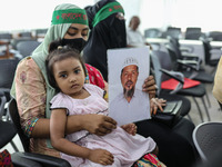 Family members of the victims of enforced disappearance hold portraits of their disappeared relatives during a press conference at the Natio...