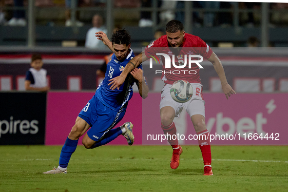 Maxim Cojocaru of Moldova challenges for the ball with Jean Borg of Malta during the UEFA Nations League, League D, Group D2 soccer match be...