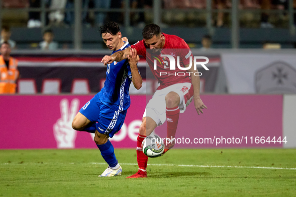 Maxim Cojocaru of Moldova challenges for the ball with Jean Borg of Malta during the UEFA Nations League, League D, Group D2 soccer match be...