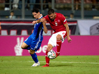 Maxim Cojocaru of Moldova challenges for the ball with Jean Borg of Malta during the UEFA Nations League, League D, Group D2 soccer match be...