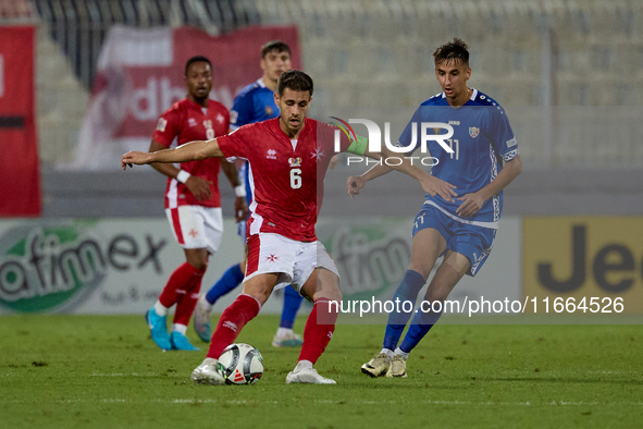 Matthew Guillaumier of Malta is closely followed by Mihail Caimacov of Moldova during the UEFA Nations League, League D, Group D2 soccer mat...