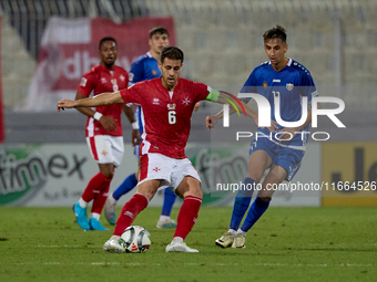 Matthew Guillaumier of Malta is closely followed by Mihail Caimacov of Moldova during the UEFA Nations League, League D, Group D2 soccer mat...