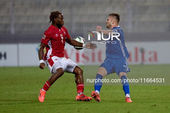 Oleg Reabciuk of Moldova competes for the ball with Joseph Mbong of Malta during the UEFA Nations League, League D, Group D2 soccer match be...