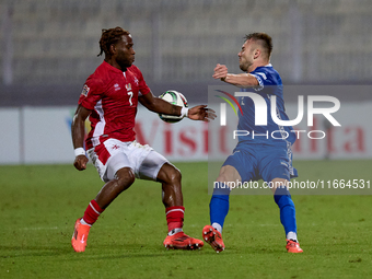 Oleg Reabciuk of Moldova competes for the ball with Joseph Mbong of Malta during the UEFA Nations League, League D, Group D2 soccer match be...