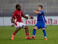 Oleg Reabciuk of Moldova competes for the ball with Joseph Mbong of Malta during the UEFA Nations League, League D, Group D2 soccer match be...