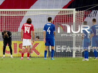 In Ta' Qali, Malta, on October 13, 2024, Moldova goalkeeper Dumitru Celeadnic reacts in disillusion after conceding a penalty during the UEF...