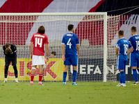 In Ta' Qali, Malta, on October 13, 2024, Moldova goalkeeper Dumitru Celeadnic reacts in disillusion after conceding a penalty during the UEF...