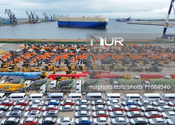 Chinese domestically made cars and construction machinery gather for shipment for export at Yantai Port in Shandong province, China, on Octo...