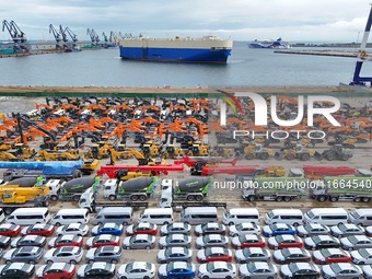 Chinese domestically made cars and construction machinery gather for shipment for export at Yantai Port in Shandong province, China, on Octo...