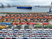 Chinese domestically made cars and construction machinery gather for shipment for export at Yantai Port in Shandong province, China, on Octo...