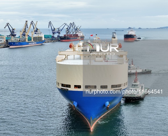 Foreign trade vessels dock to load and unload cargo at Yantai Port in Yantai, Shandong province, China, on October 14, 2024. On October 14,...