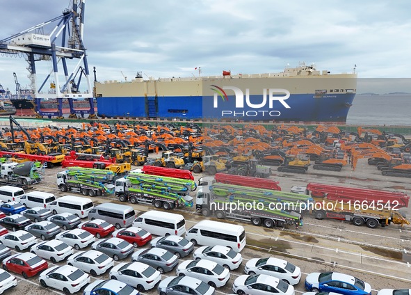 Chinese domestically made cars and construction machinery gather for shipment for export at Yantai Port in Shandong province, China, on Octo...