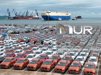 Chinese-made cars wait to be loaded for export at Yantai Port in Yantai, Shandong province, China, on October 14, 2024. On October 14, 2024,...