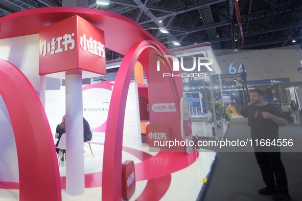 Visitors visit the stand of Little Red Book at an exhibition in Hangzhou, Zhejiang province, China, on September 25, 2024. 