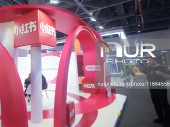 Visitors visit the stand of Little Red Book at an exhibition in Hangzhou, Zhejiang province, China, on September 25, 2024. (