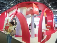 Visitors visit the stand of Little Red Book at an exhibition in Hangzhou, Zhejiang province, China, on September 25, 2024. (