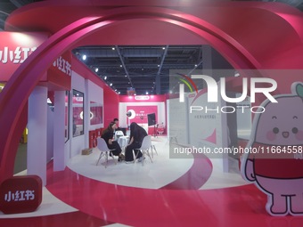 Visitors visit the stand of Little Red Book at an exhibition in Hangzhou, Zhejiang province, China, on September 25, 2024. (