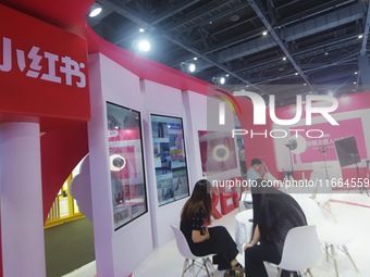 Visitors visit the stand of Little Red Book at an exhibition in Hangzhou, Zhejiang province, China, on September 25, 2024. (