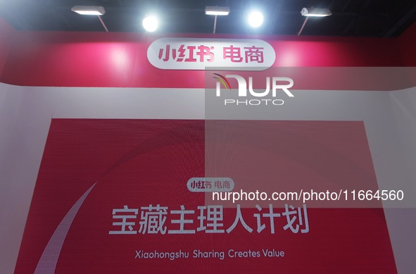 Visitors visit the stand of Little Red Book at an exhibition in Hangzhou, Zhejiang province, China, on September 25, 2024. 