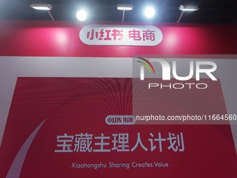 Visitors visit the stand of Little Red Book at an exhibition in Hangzhou, Zhejiang province, China, on September 25, 2024. (