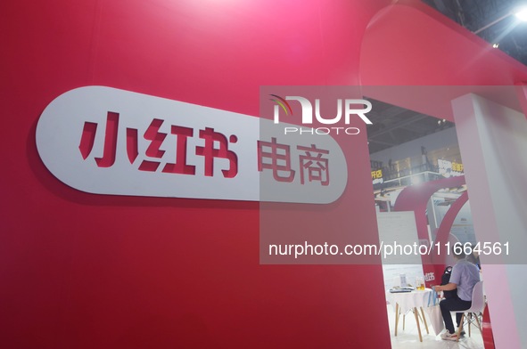 Visitors visit the stand of Little Red Book at an exhibition in Hangzhou, Zhejiang province, China, on September 25, 2024. 