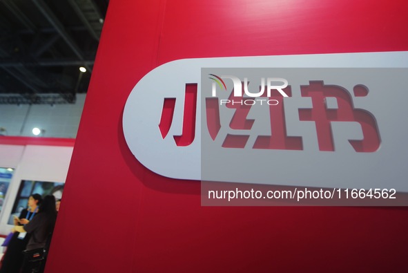 Visitors visit the stand of Little Red Book at an exhibition in Hangzhou, Zhejiang province, China, on September 25, 2024. 