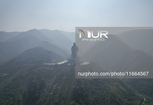 The statue of Guan Gong, the world's tallest saint, is seen under mist in Yuncheng, China, on October 14, 2024. 