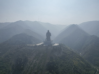 The statue of Guan Gong, the world's tallest saint, is seen under mist in Yuncheng, China, on October 14, 2024. (