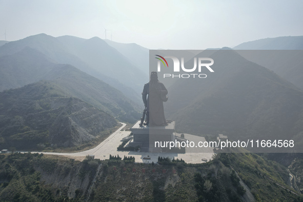 The statue of Guan Gong, the world's tallest saint, is seen under mist in Yuncheng, China, on October 14, 2024. 