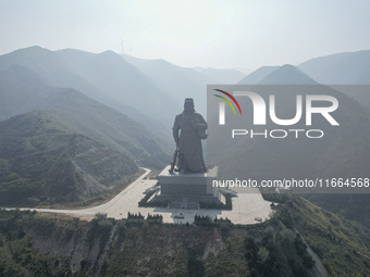 The statue of Guan Gong, the world's tallest saint, is seen under mist in Yuncheng, China, on October 14, 2024. (