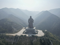 The statue of Guan Gong, the world's tallest saint, is seen under mist in Yuncheng, China, on October 14, 2024. (