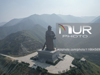 The statue of Guan Gong, the world's tallest saint, is seen under mist in Yuncheng, China, on October 14, 2024. (