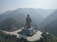 The statue of Guan Gong, the world's tallest saint, is seen under mist in Yuncheng, China, on October 14, 2024. (