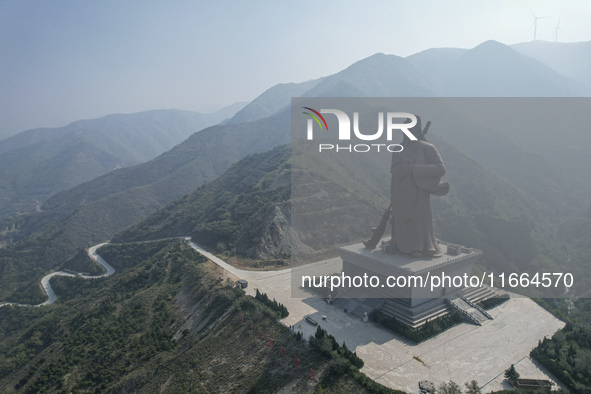 The statue of Guan Gong, the world's tallest saint, is seen under mist in Yuncheng, China, on October 14, 2024. 