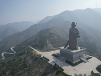 The statue of Guan Gong, the world's tallest saint, is seen under mist in Yuncheng, China, on October 14, 2024. (