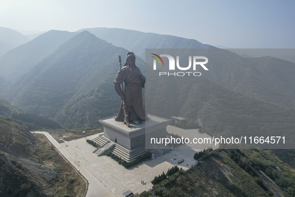 The statue of Guan Gong, the world's tallest saint, is seen under mist in Yuncheng, China, on October 14, 2024. 