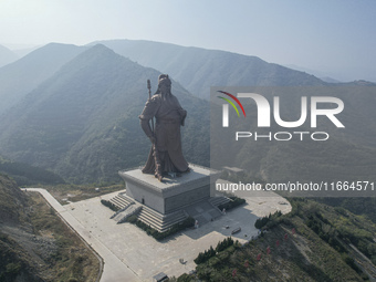 The statue of Guan Gong, the world's tallest saint, is seen under mist in Yuncheng, China, on October 14, 2024. (