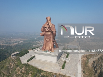 The statue of Guan Gong, the world's tallest saint, is seen under mist in Yuncheng, China, on October 14, 2024. (