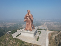 The statue of Guan Gong, the world's tallest saint, is seen under mist in Yuncheng, China, on October 14, 2024. (