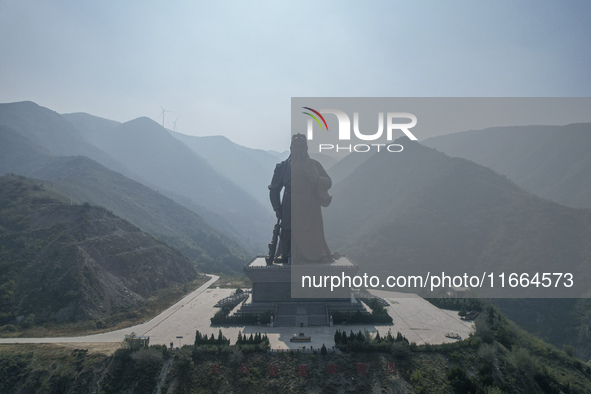 The statue of Guan Gong, the world's tallest saint, is seen under mist in Yuncheng, China, on October 14, 2024. 