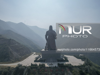 The statue of Guan Gong, the world's tallest saint, is seen under mist in Yuncheng, China, on October 14, 2024. (