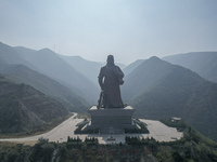 The statue of Guan Gong, the world's tallest saint, is seen under mist in Yuncheng, China, on October 14, 2024. (