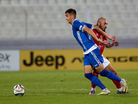 In Ta' Qali, Malta, on October 13, 2024, Mihail Caimacov of Moldova is challenged by Teddy Teuma of Malta during the UEFA Nations League, Le...