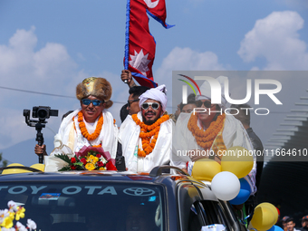 Record-setting climber Nirmal Purja, also known as Nimsdai, cheers as he arrives back in Kathmandu, Nepal, on October 14, 2024, after comple...