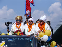 Record-setting climber Nirmal Purja, also known as Nimsdai, cheers as he arrives back in Kathmandu, Nepal, on October 14, 2024, after comple...