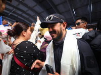 Record-setting climber Nirmal Purja, also known as Nimsdai, arrives back in Kathmandu, Nepal, on October 14, 2024, after completing the summ...