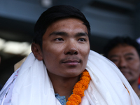 Nima Rinji Sherpa, 18, the youngest summiteer to have climbed all 14 of the world's peaks towering over 8000 meters, arrives at Tribhuvan In...