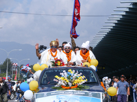 Record-setting climber Nirmal Purja, also known as Nimsdai, cheers as he arrives back in Kathmandu, Nepal, on October 14, 2024, after comple...