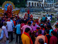 Hindu devotees immerse an idol of the Hindu goddess Durga into the Bagmati River in Kathmandu, Nepal, on October 14, 2024. In Hindu mytholog...